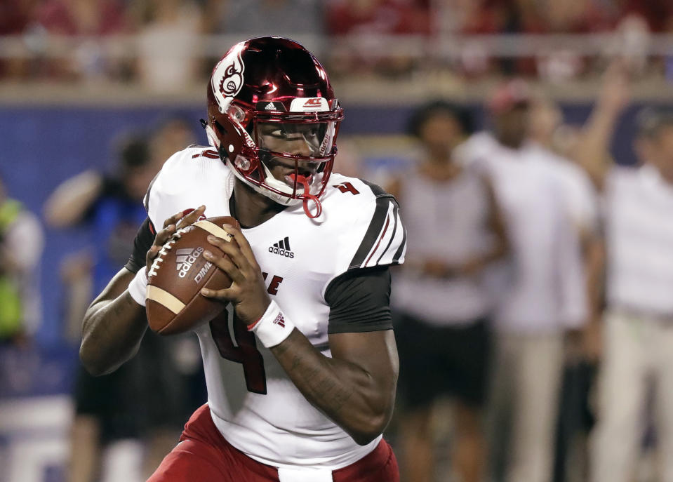 Louisville quarterback Jawon Pass looks for a receiver during the first half of the team's NCAA college football game against Alabama, Saturday, Sept. 1, 2018, in Orlando, Fla. (AP Photo/John Raoux)
