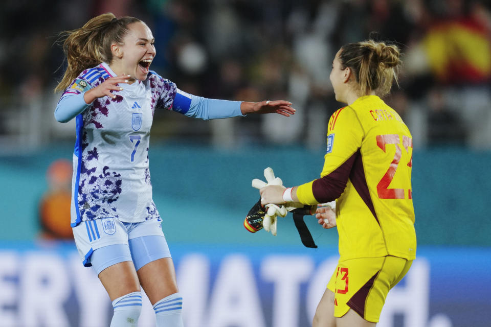 Spain's Irene Guerrero, left, runs to teammate and goalkeeper Cata Coll following the Women's World Cup second round soccer match between Switzerland and Spain at Eden Park in Auckland, New Zealand, Saturday, Aug. 5, 2023. (AP Photo/Abbie Parr)