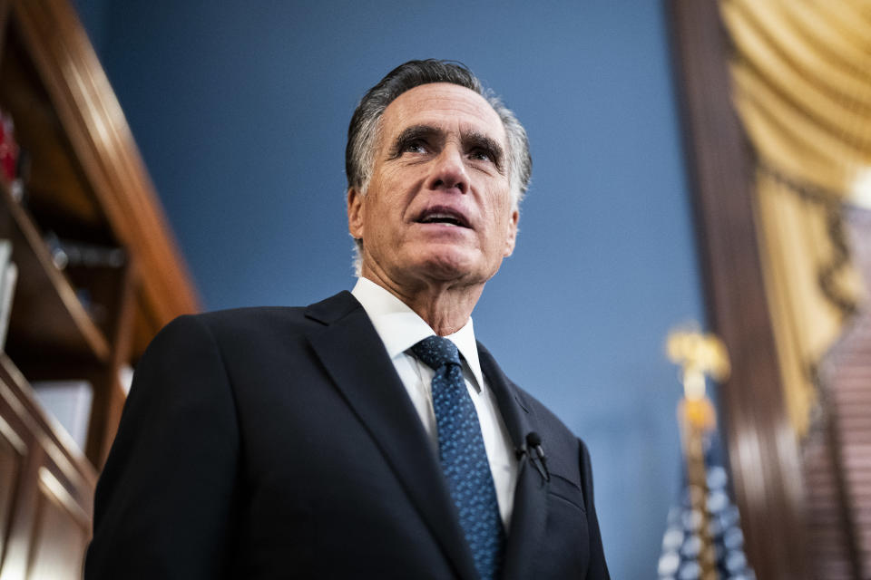 Sen. Mitt Romney, R-Utah, speaks with reporters on Wednesday after announcing that he will not seek reelection.