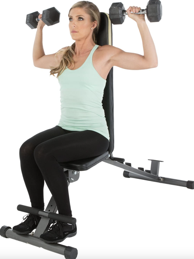 Fitness Reality Bench with blonde woman in light green tank top and black leggings sitting (Photo via Amazon)