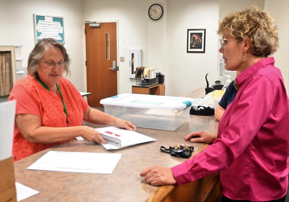 Branch County clerk Terry Kubasiak and Coldwater Township clerk Diane Morrison check in August 2022 elections results.