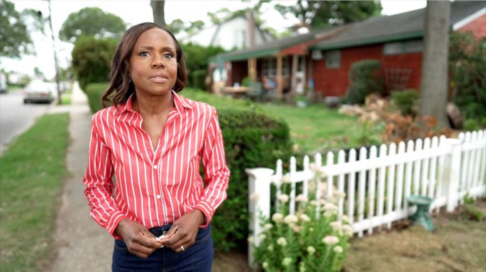 PHOTO: Deborah Roberts stands in front of the home of the alleged Long Island Serial Killer, Rex Heuermann. (ABC News)