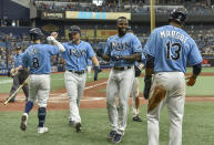 Tampa Bay Rays designated hitter Randy Arozarena, second right, celebrates a grand slam off Baltimore Orioles reliever Cesar Valdez with Brandon Lowe (8), Austin Meadows and Manuel Margot (13) during the seventh inning of a baseball game Sunday, June 13, 2021, in St. Petersburg, Fla. (AP Photo/Steve Nesius)