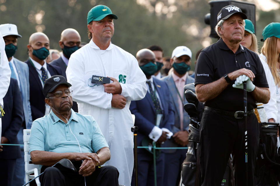 Wayne Player holds a sleeve of golf balls near Lee Elder during the ceremonial tee shots of the Masters. (Mike Segar/Reuters)