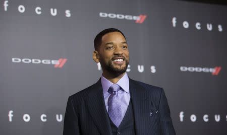 Cast member Will Smith poses at the premiere of "Focus" at the TCL Chinese theatre in Hollywood, California February 24, 2015. The movie opens in the U.S. on February 27. REUTERS/Mario Anzuoni