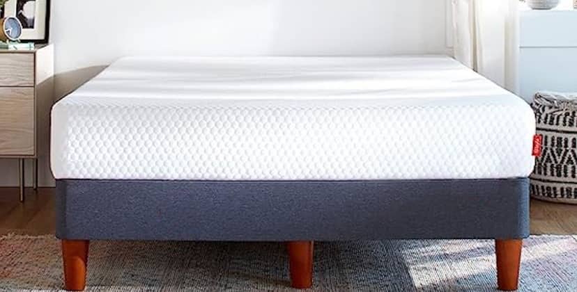  Layla The Essential Mattress review image shows the white mattress on a grey divan bed base. 