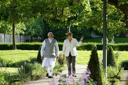 German Chancellor Angela Merkel talks to Indian Prime Minister Narendra Modi during their meeting at the German government guesthouse Meseberg Palace in Meseberg, Germany, May 29, 2017. REUTERS/Fabrizio Bensch