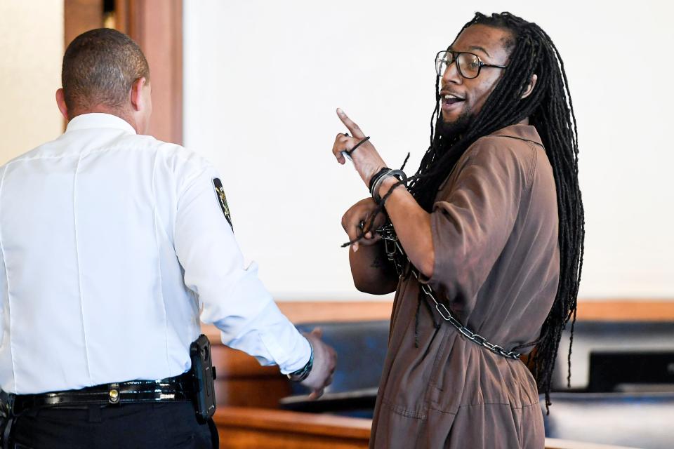 Nathaniel Dixon says "love y'all," to people in the courtroom after being sentenced to life in prison July 16, 2019 in Asheville.