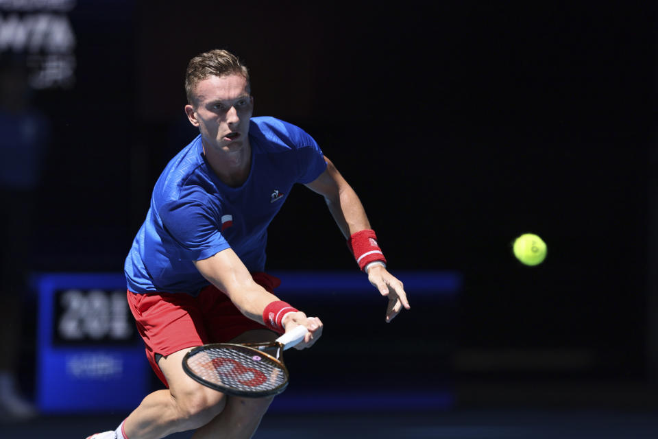 Jiri Lehecka of the Czech Republic hits a forehand return to Zhizen Zhang of China during the United Cup tennis tournament in Perth, Australia, Saturday, Dec. 30, 2023. (AP Photo/Trevor Collens)