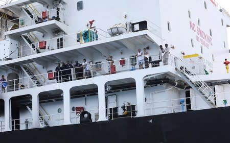 Members of the crew of Japanese-owned Kokuka Courageous tanker are seen off the coast of Fujairah