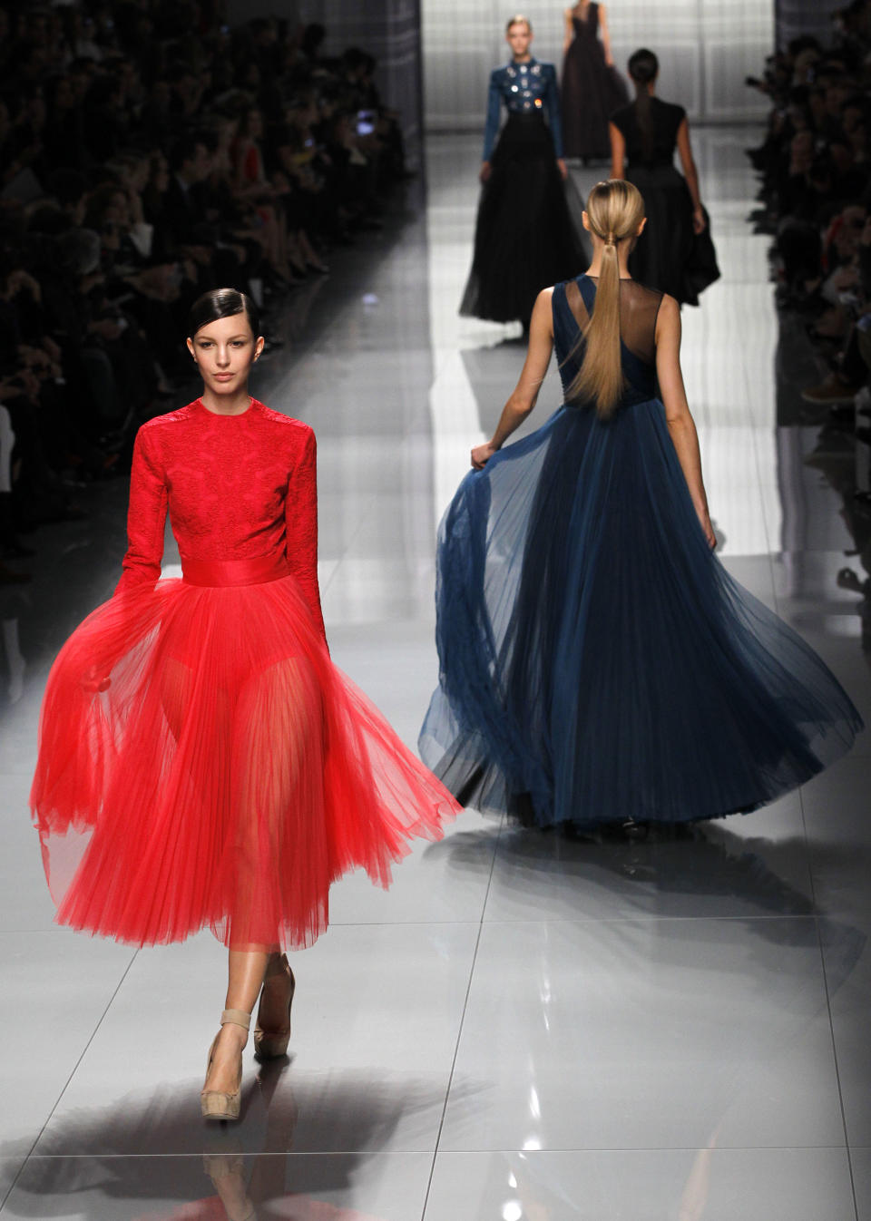 Models wear creations from designer Christian Dior as part of the Fall-Winter, ready-to-wear 2013 fashion collection, during Paris Fashion week, Friday, March 2, 2012. (AP Photo/Christophe Ena)
