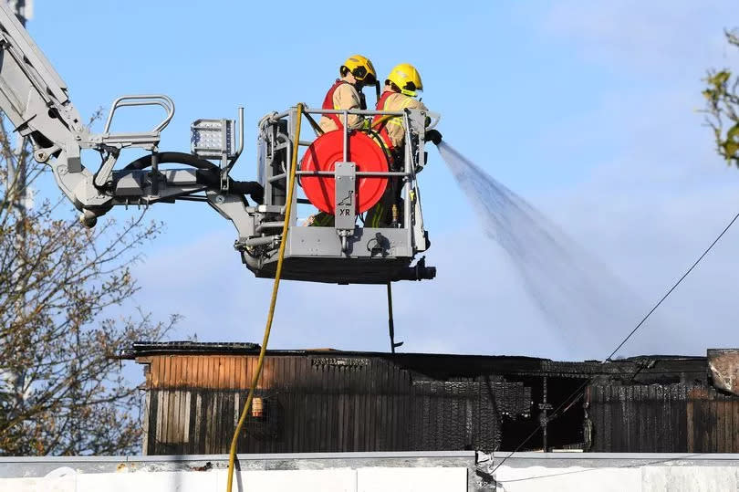 Firefighters use an Aerial Appliance at the scene on Lower Lane.(Pic Andrew Teebay).