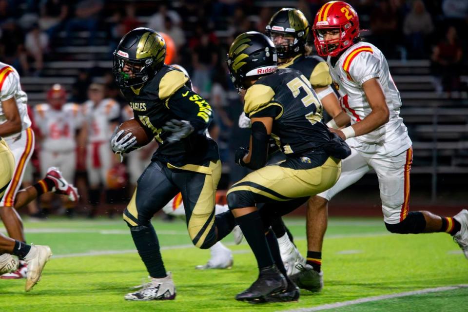 Aiden Muhammad, 4, of Enochs High works his way up field during the Oakdale vs Enochs game Friday Sept. 22, 2023