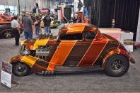 <p>Artist and hot rodder Coby Gewertz’s striking coupe already claimed Hot Rod of the Year at the 7th BASF Nashville Nationals in May this year and is now a finalist in SEMA’s Battle of the Builders. Notable for its drag-race-inspired vertical stripes and gold leaf accents, the rod was built by South City Rod & Custom around a body sourced from <strong>Mike Wolfe</strong> of the <strong><em>American Pickers</em></strong> TV show.</p>