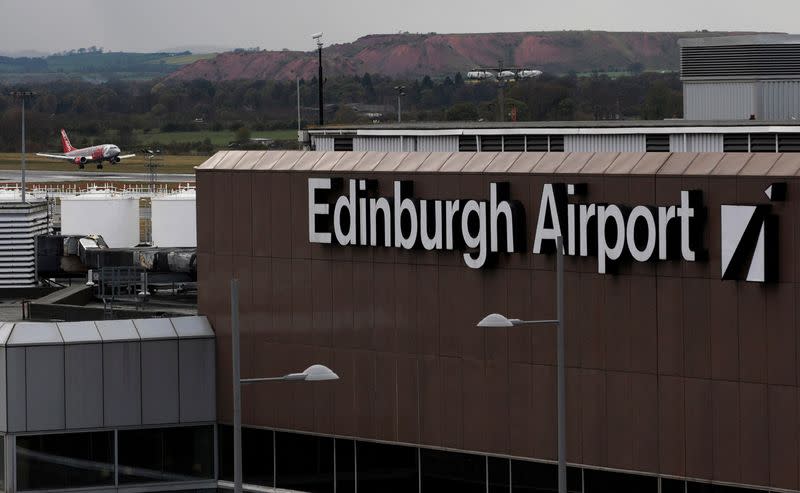 FILE PHOTO: An aircraft lands at Edinburgh Airport in Scotland