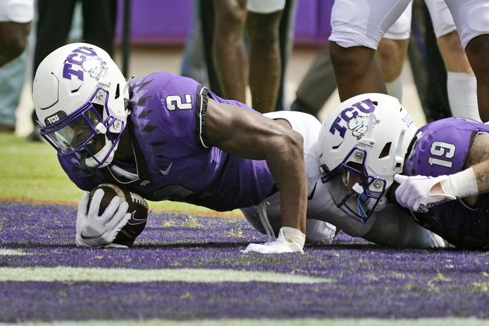 TCU running back Trey Sanders (2) scores a touchdown next to teammate tight end Jared Wiley (19) during the first half of an NCAA college football game against Colorado Saturday, Sept. 2, 2023, in Fort Worth, Texas. (AP Photo/LM Otero)