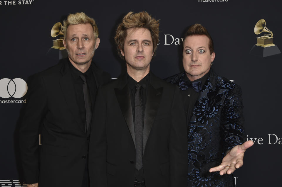 Mike Dirnt, from left, Billie Joe Armstrong, and Tre Cool of Green Day arrive at the Pre-Grammy Gala on Saturday, Feb. 3, 2024, at the Beverly Hilton Hotel in Beverly Hills, Calif. (Photo by Richard Shotwell/Invision/AP)