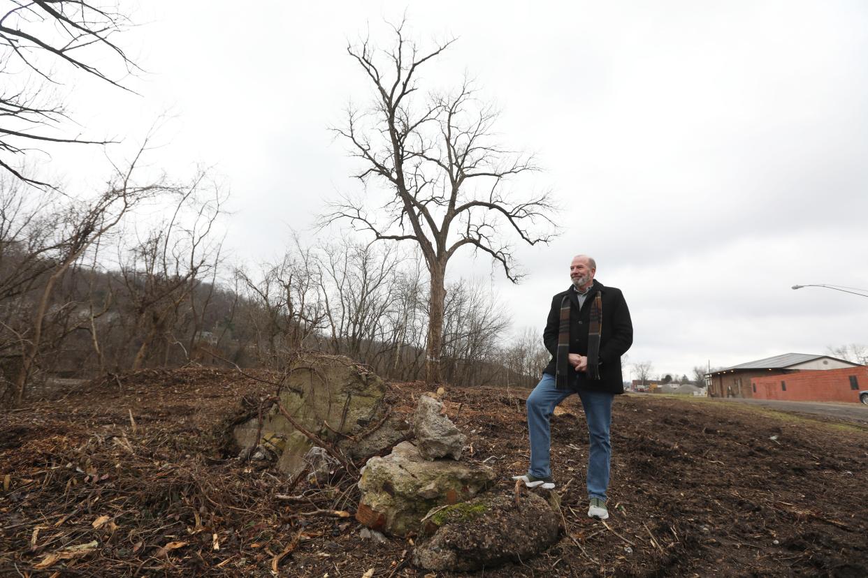 Russell Edgington, executive director of the Muskingum Valley Park District, stands at the edge of what will become the Putnam Greenway in the Putnam neighborhood in Zanesville.