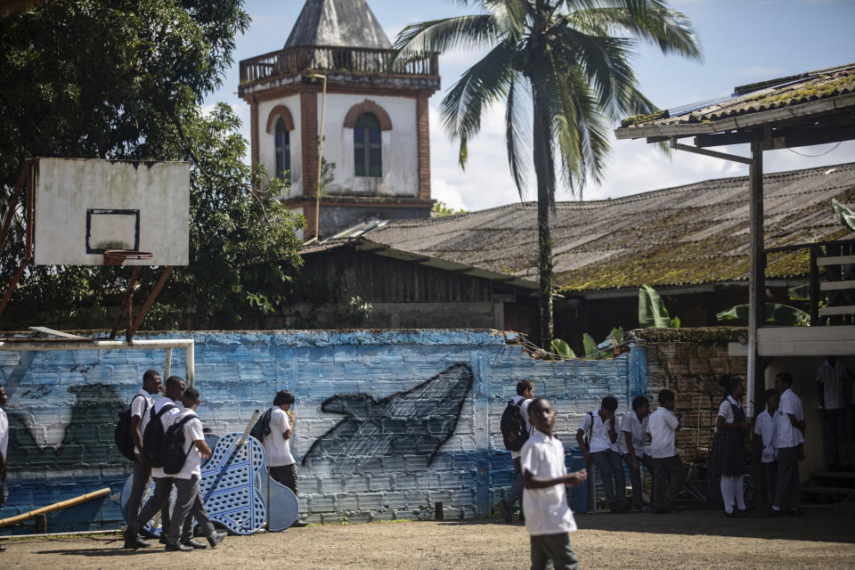 A mural of a humpback whale graces a wall of the Luis Lopez de Mesa school, in Bahía Solano, Colombia, Tuesday, Aug. 29, 2023. Every year the Colombian population of Bahía Solano welcomes humpback whales and a great number of tourists who arrive to watch them as they pass through the Pacific. (AP Photo/Ivan Valencia)