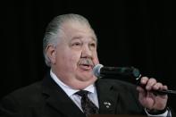 FILE-- In this April 11, 2014, file photo, Iowa Senate candidate Sam Clovis speaks during the Iowa Republican Party's annual Lincoln Day dinner in Cedar Rapids, Iowa. A GOP TV spot comparing castrating hogs to cutting spending, and Democrat Bruce Braley’s comment that lawyers like him are better suited to serve on the Senate Judiciary Committee than “an Iowa farmer” like U.S. Sen. Charles Grassley, have raised the Iowa’s open Senate seat on the GOP’s list of winnable races in the 2014 elections. (AP Photo/Charlie Neibergall)