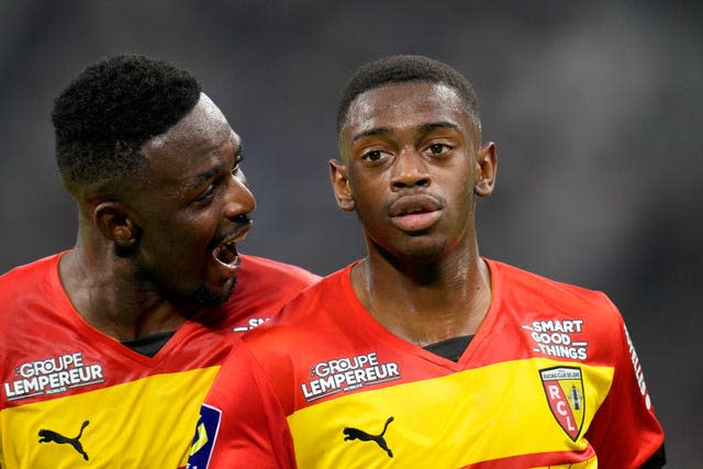 Lens’ David Costa (right) is congratulated by team-mate Salis Abdul Samed