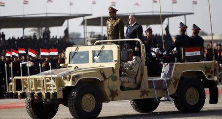 Iraqi Prime Minister Haider al-Abadi takes part in the Iraqi Army Day anniversary celebration in Baghdad in this January 6, 2015 file photo. REUTERS/Thaier Al-Sudani/Files