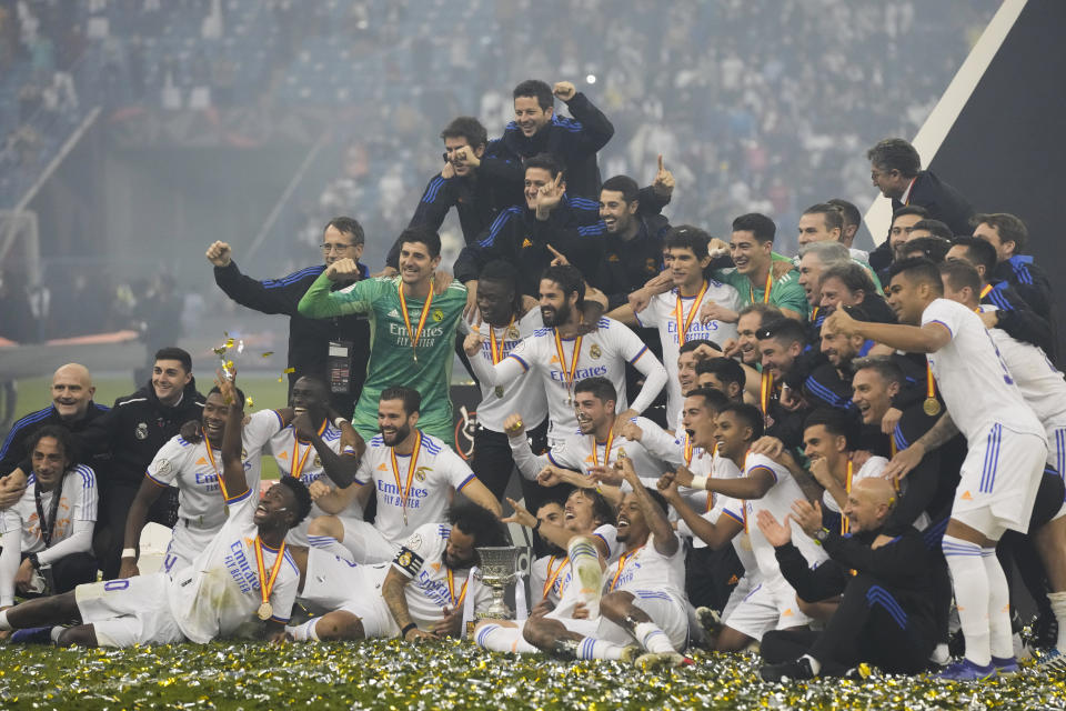 Real Madrid's players celebrate after winning the Spanish Super Cup final soccer match between Real Madrid and Athletic Bilbao at King Fahd stadium in Riyadh, Saudi Arabia, Sunday, Jan. 16, 2022. (AP Photo/Hassan Ammar)