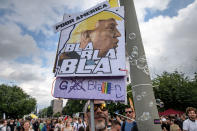 <p>A demonstrator holds a placard with the face of President Donald Trump and the slogan ‘Bla Bla Bal G20 Bubbels’ while he attend a march against the G20 Summit with the topic ‘Solidarity without borders instead of G20!’ on July 8, 2017 in Hamburg, Germany. (Photo: Thomas Lohnes/Getty Images) </p>