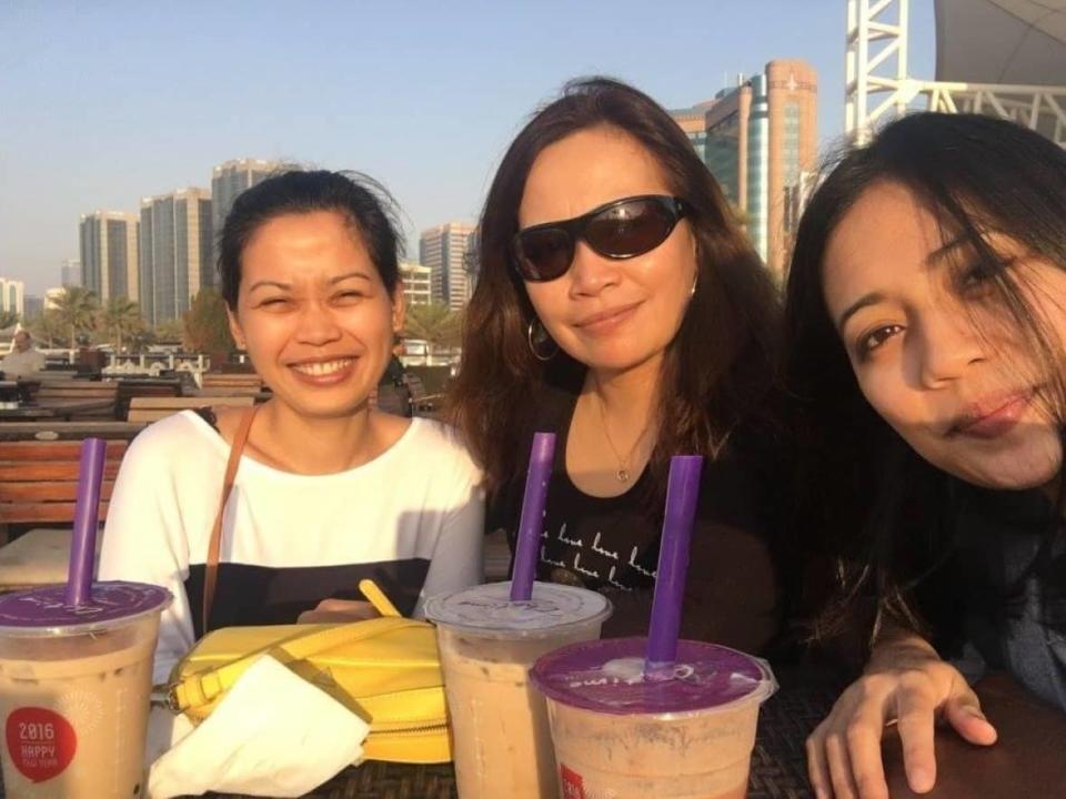 April Nuval, left, her mother Joy Thompson and sister Aubrey Nuval are pictured together in Abu Dhabi. The family entered into a service agreement for $24,000 with Toronto-based Apex Connection Corp. to process April and Aubrey's immigration applications, so that they and their partners could join their mother in Canada. (Submitted by Joy Thompson - image credit)