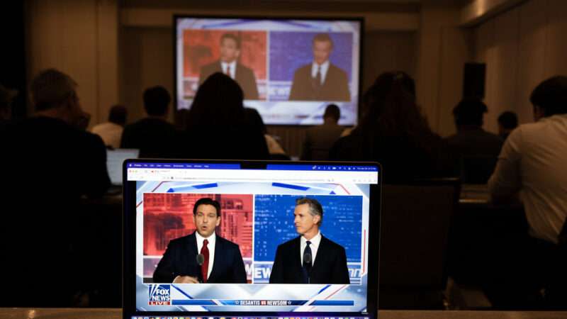 Florida Governor Ron DeSantis on screen debating California Governor Gavin Newsom