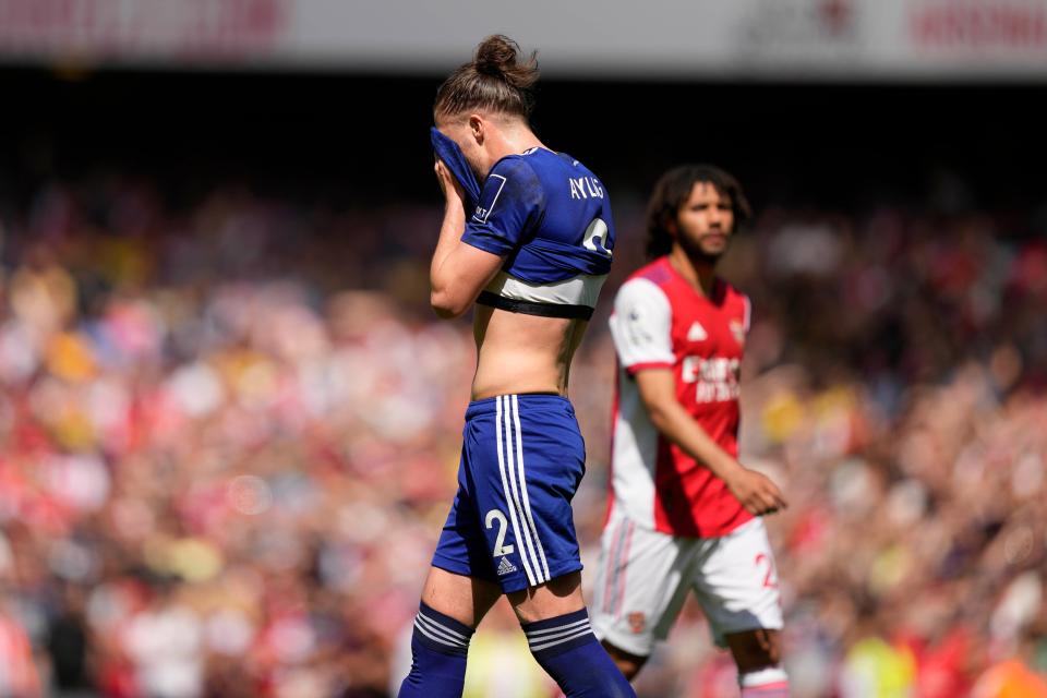 Leeds United's Luke Ayling, leaves the pitch after receiving a red card (AP)