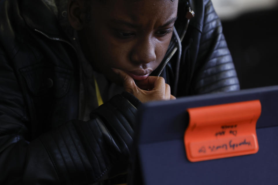 Kynnedy Lewis watches her screen as she prepares for the digital SAT, Wednesday, March 6, 2024, at Holy Family Cristo Rey Catholic High School in Birmingham, Ala. (AP Photo/Butch Dill)