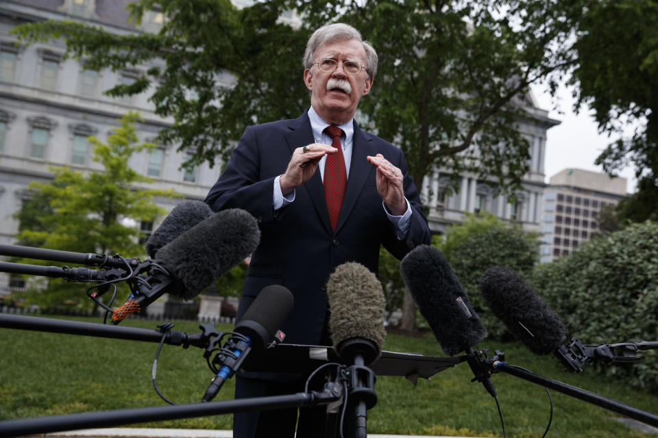 FILE - In this May 1, 2019, file photo, National security adviser John Bolton talks to reporters about Venezuela, outside the White House, in Washington. The Associated Press learned that at least twice since 2016, the U.S. government missed chances to cultivate relations with top Venezuelan regime insiders, who Bolton said backed out of a plan to topple President Nicolás Maduro. (AP Photo/Evan Vucci, File)