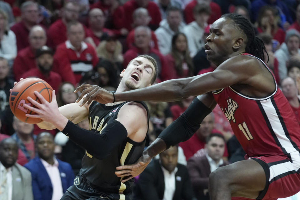 Rutgers center Clifford Omoruyi (11) fouls Purdue guard Braden Smith in the first half of an NCAA college basketball game, Sunday, Jan. 28, 2024, in Piscataway, N.J. (AP Photo/Mary Altaffer)