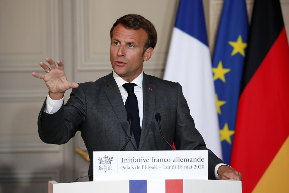 French President Emmanuel Macron speaks during a joint video press conference with German Chancellor Angela Merkel at the Elysee Palace Monday, May 18, 2020 in Paris. France and Germany discussed Europe's economic recovery plans to respond to the virus crisis. (AP Photo/Francois Mori, Pool)