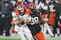 Cleveland Browns defensive tackle Sheldon Richardson (98) sacks Cincinnati Bengals quarterback Joe Burrow (9) during the first half of an NFL football game Thursday, Sept. 17, 2020, in Cleveland. (AP Photo/David Richard)