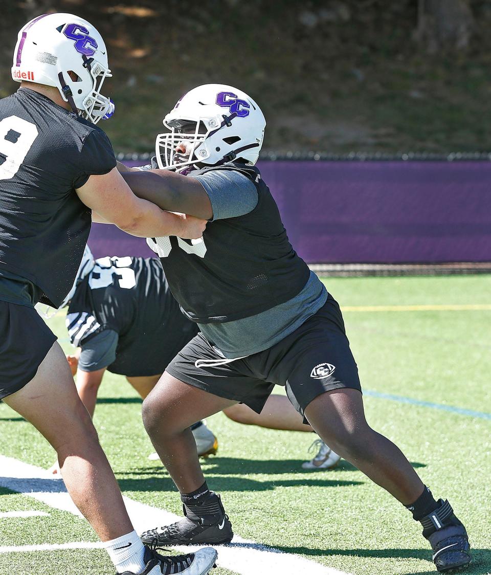 Defensive lineman Sproul Derolus, of Stoughton, competes at a Curry College football practice on Friday, Aug. 12, 2022.