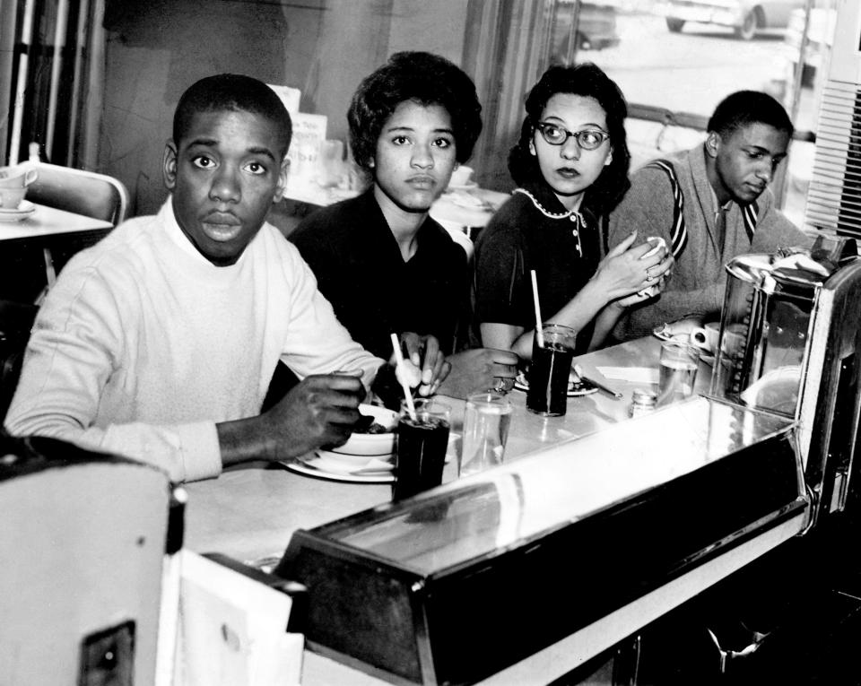 Students, from left, Matthew Walker, Peggy Alexander, Diane Nash and Stanley Hemphill eat lunch at the previously segregated counter of the Post House Restaurant in Nashville's Greyhound bus terminal on March 16, 1960.