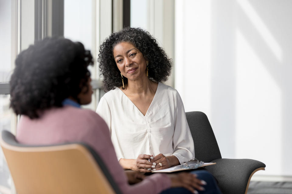 Woman speaks to her therapist