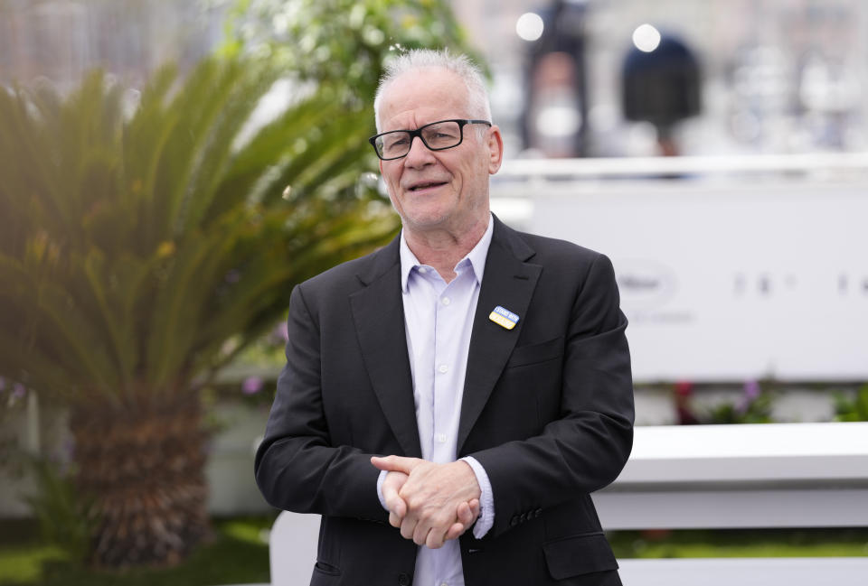 Festival director Thierry Fremaux, wearing a badge that reads "I stand with Ukraine," poses for photographers at the photo call honoring Michael Douglas with a Palme d'Or at the 76th international film festival, Cannes, southern France, Tuesday, May 16, 2023. (Photo by Scott Garfitt/Invision/AP)