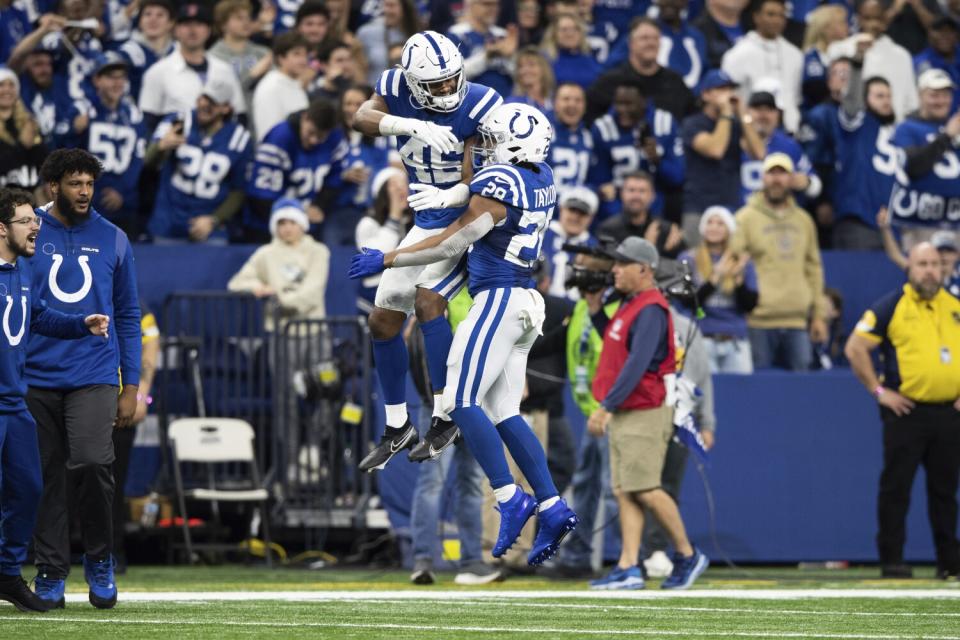 Indianapolis Colts linebacker E.J. Speed and running back Jonathan Taylor celebrate a touchdown.