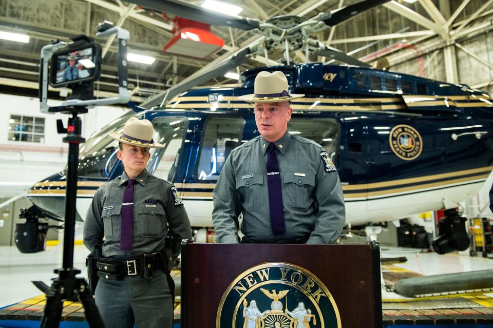 Troop F Major Paul DeQuarto, center, talks during a press conference on recruiting new Troopers at the New York State Police Aviation hangar at New York Stewart International Airport in New Windsor, NY, on Thursday, February 10, 2022.