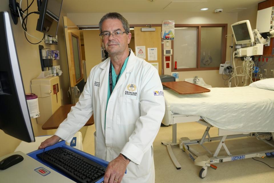 Arizona Burn Center Valleywise Health Director Dr. Kevin Foster in a Burn Center hospital room Monday, June 14, 2021, in Phoenix. Emergency rooms like the one at the Arizona Burn Center in Phoenix, where director Foster said 104 people were admitted in June, July and August 2020 with serious burn injuries due to contact with hot surfaces. (AP Photo/Ross D. Franklin)