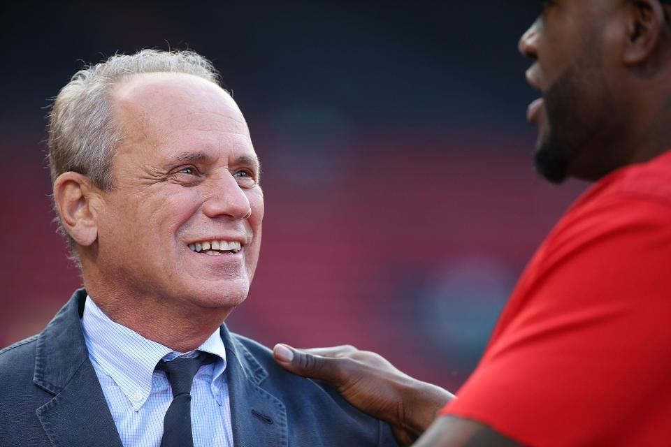 BOSTON, MA - SEPTEMBER 22:  Larry Lucchino, former president of the Boston Red Sox, smiles as he talks to David Ortiz before a game against the Tampa Bay Rays at Fenway Park on September 22, 2015 in Boston, Massachusetts.  (Photo by Jim Rogash/Getty Images)