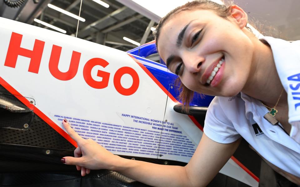 Visa Cash App RB F1 Academy driver Amna Al Qubaisi of United Arab Emirates and MP Motorsport (88) poses for a photo in the garage during practice