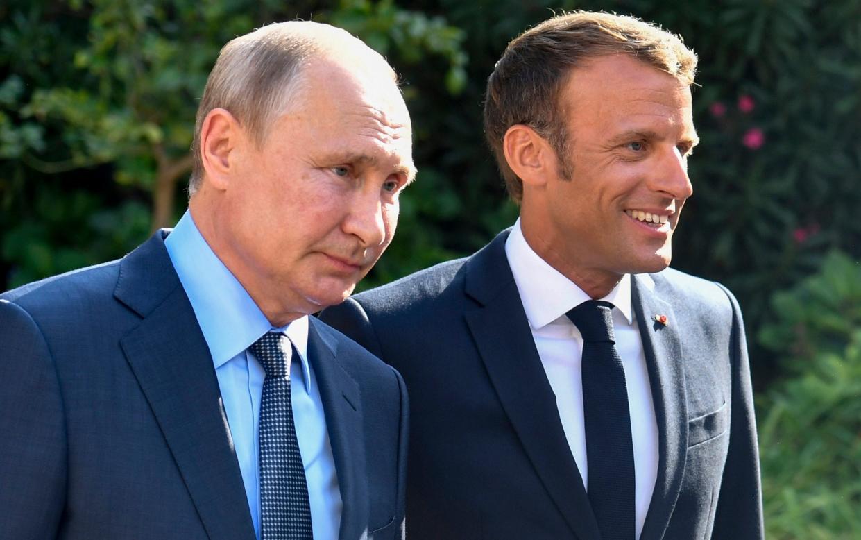 Vladimir Putin and Emmanuel Macron - Gerard Julien/Pool via AP