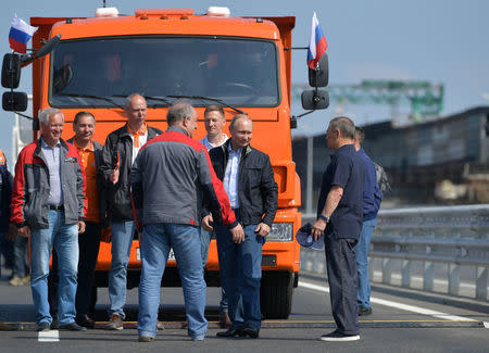 Russian President Vladimir Putin (3rd R) attends a ceremony opening a bridge, which was constructed to connect the Russian mainland with the Crimean Peninsula across the Kerch Strait, Crimea May 15, 2018. Sputnik/Alexei Druzhinin/Kremlin via REUTERS