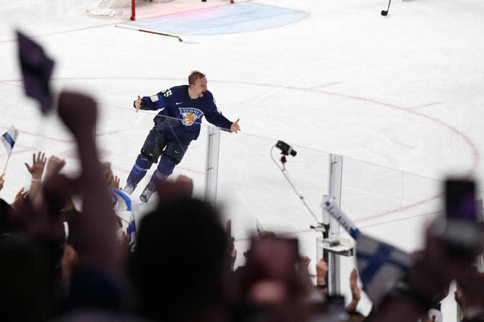 Finland's Sakari Manninen reacts to his game-winning goal during the Hockey World Championship final match between Finland and Canada, Sunday May 29, 2022, in Tampere, Finland. Finland won 4-3 in overtime. (AP Photo/Martin Meissner)