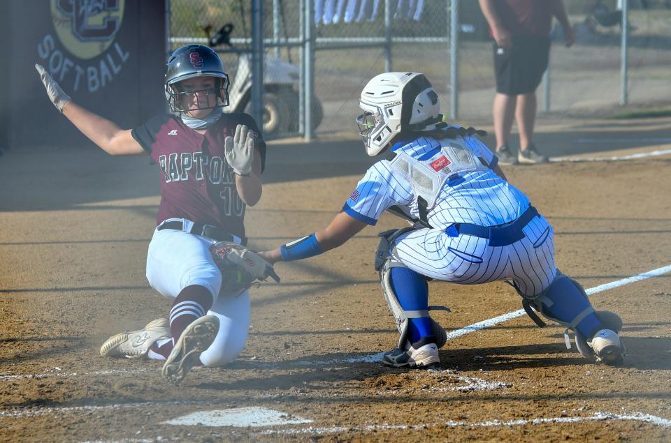 Pueblo Central catcher Jade Mares, right, tags out a Silver Creek runner at home to end the fourth inning Tuesday, Oct. 6, 2020 at Silver Creek High School in the first round of the Class 4A state playoffs.