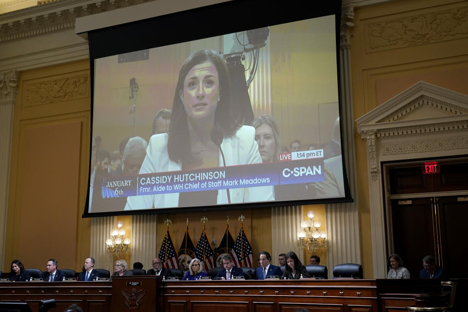 FILE - A video of former aide to White House Chief of State Mark Meadows, Cassidy Hutchinson is shown on a screen, as the House select committee investigating the Jan. 6 attack on the U.S. Capitol holds its final meeting on Capitol Hill in Washington, Dec. 19, 2022. Hutchinson told the House Jan. 6 committee that her first lawyer advised her against being fully forthcoming with the panel, telling her it was acceptable to testify that she did not recall certain events when she actually did and that “the less you remember, the better,” according to a transcript of one of her interviews released Thursday. (AP Photo/J. Scott Applewhite, File)